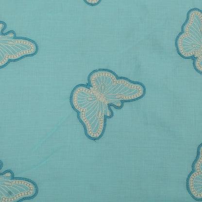 Butterfly patterns on a blue fabric background