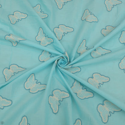 Turquoise fabric with embroidered white butterflies