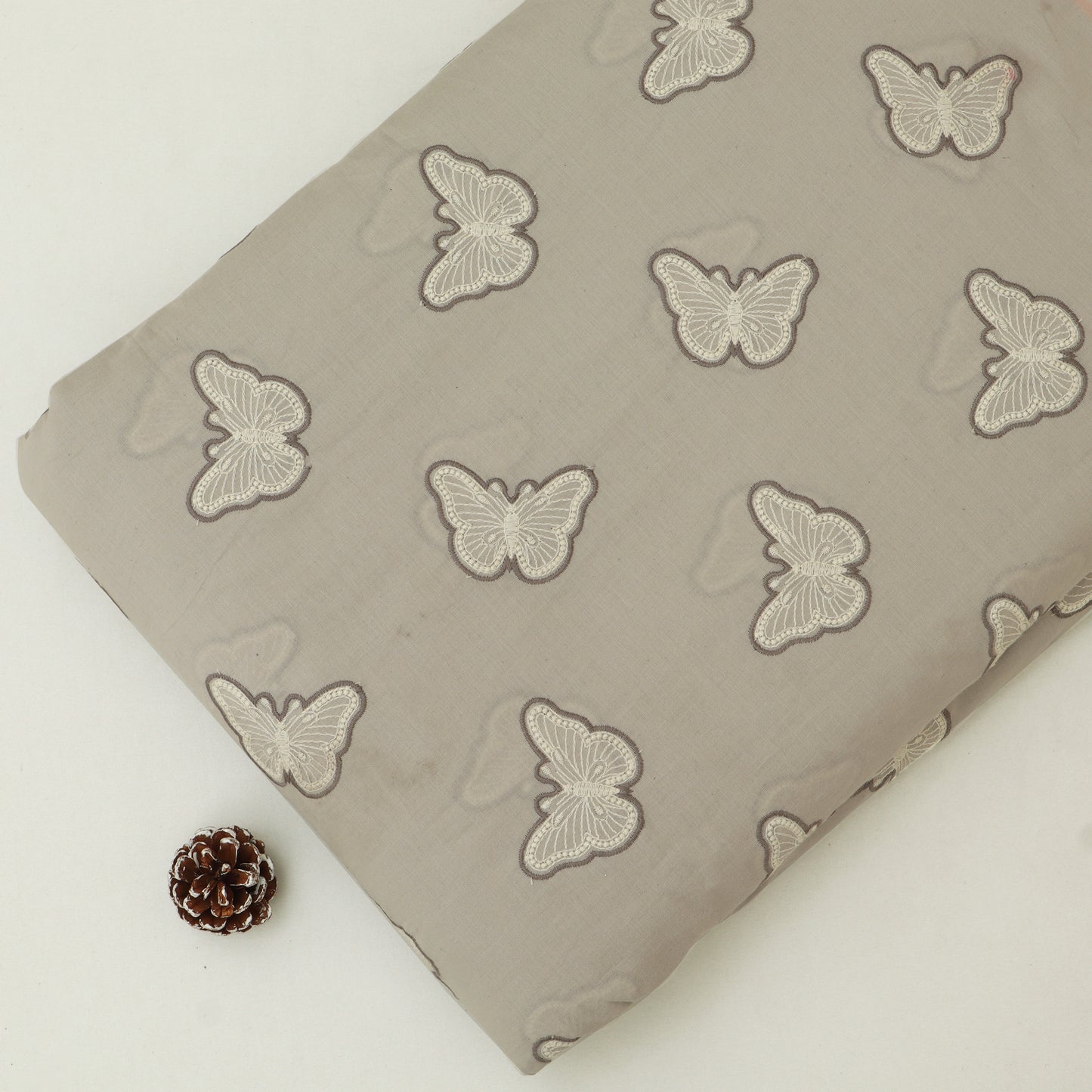 Fabric with butterfly pattern on a beige background