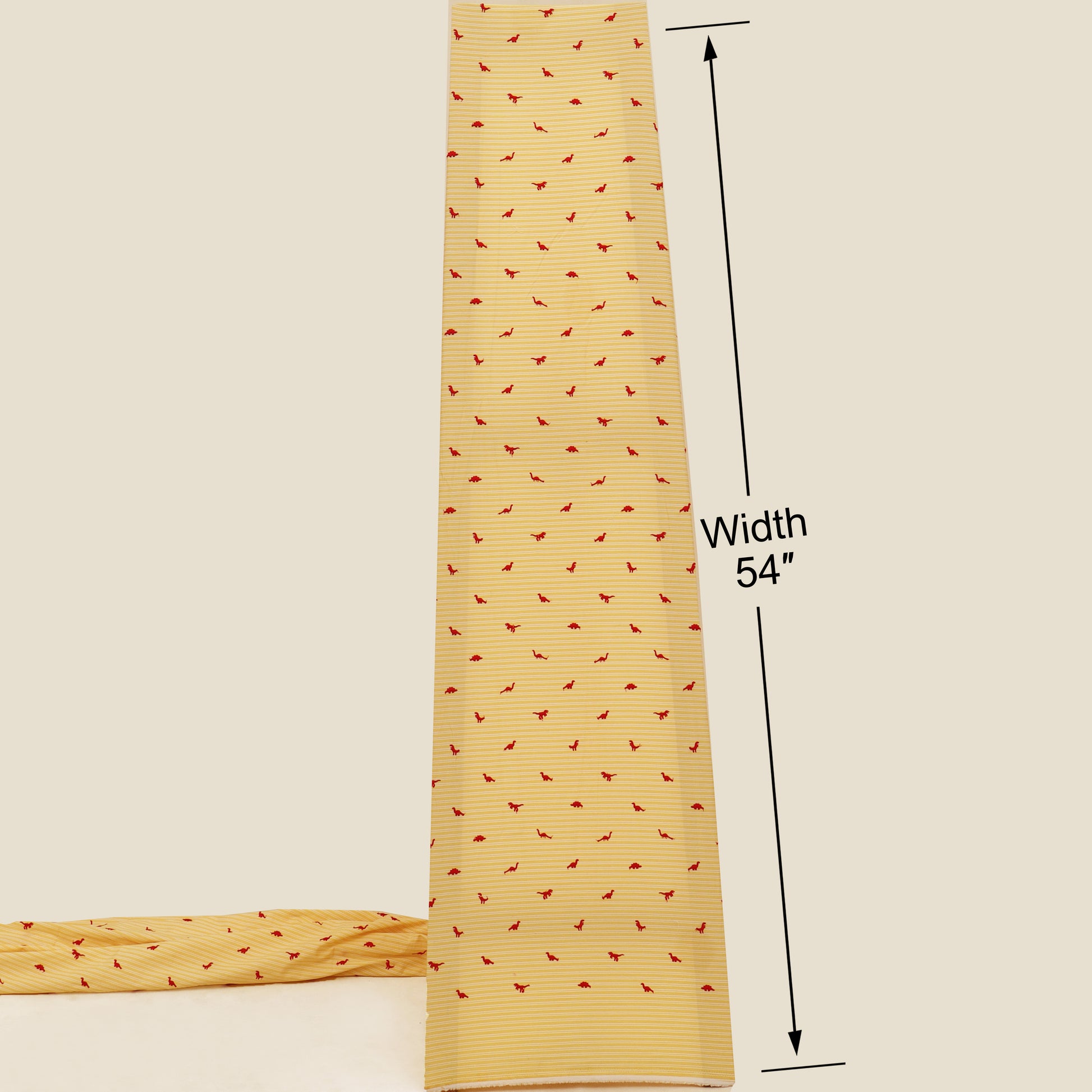 Yellow fabric with red pattern and measurement label on a beige background
