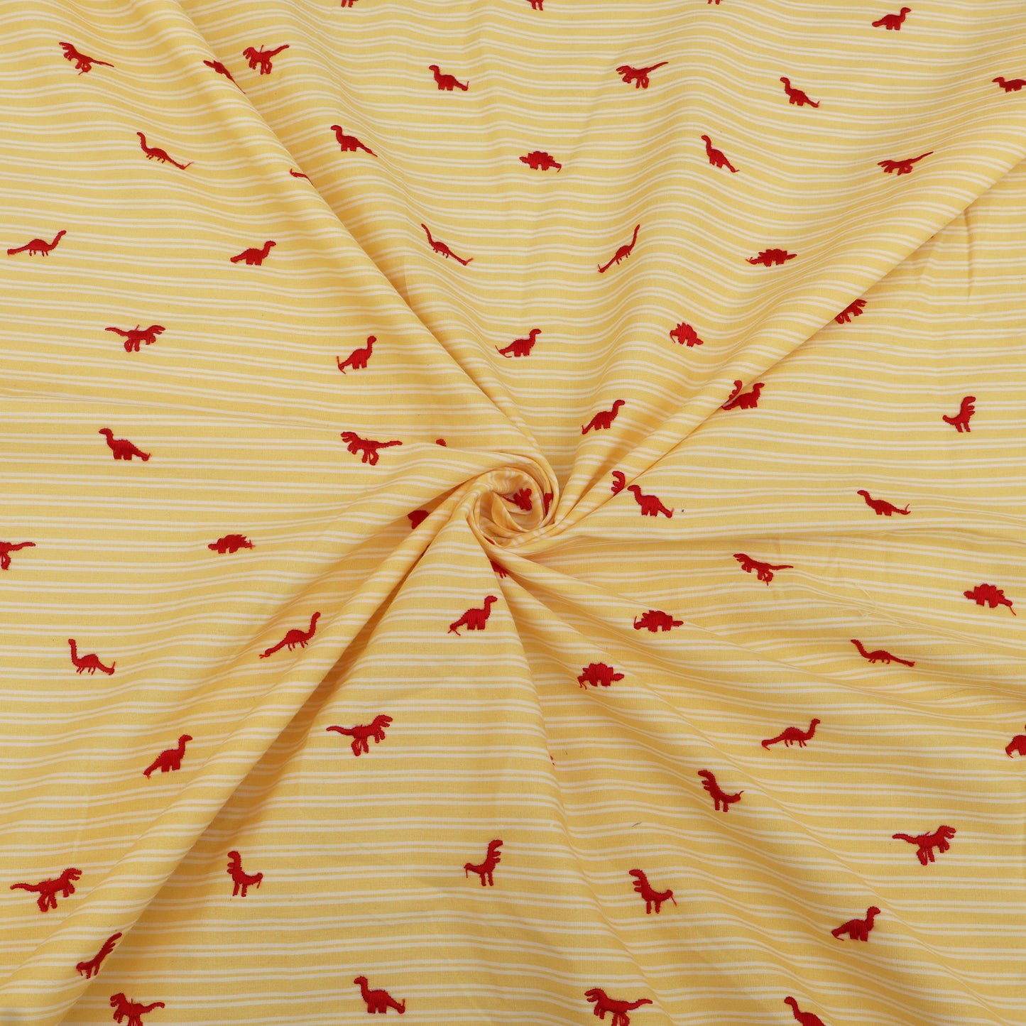 Yellow fabric with red dinosaur patterns