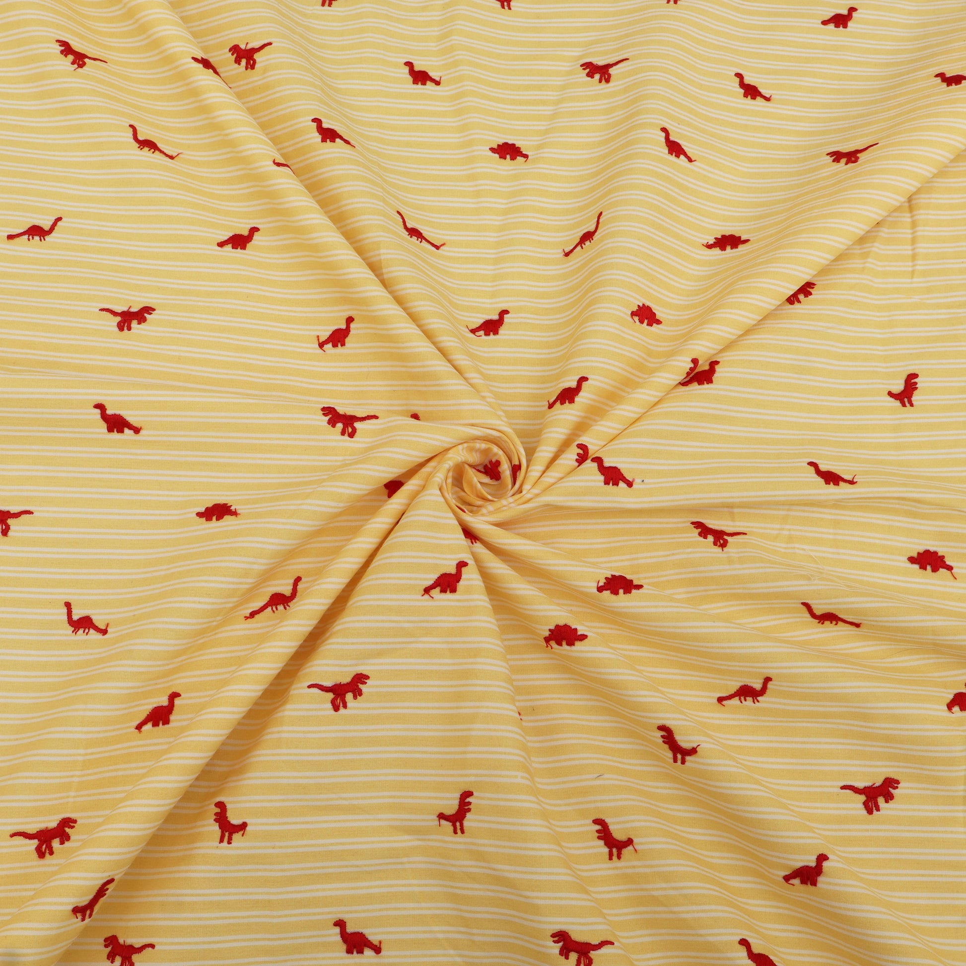 Yellow fabric with red dinosaur patterns