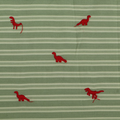 Green fabric with red dinosaur patterns