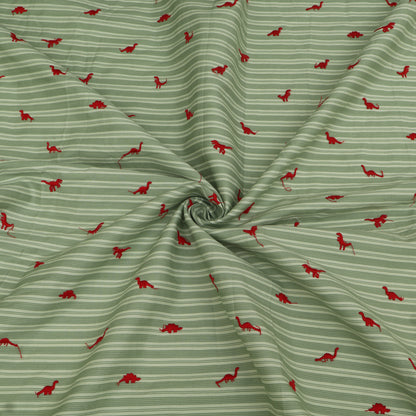 Green fabric with red dinosaur pattern