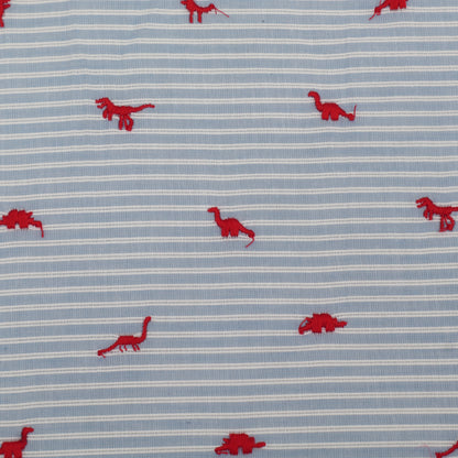 Fabric with red dinosaur patterns on a blue and white striped background