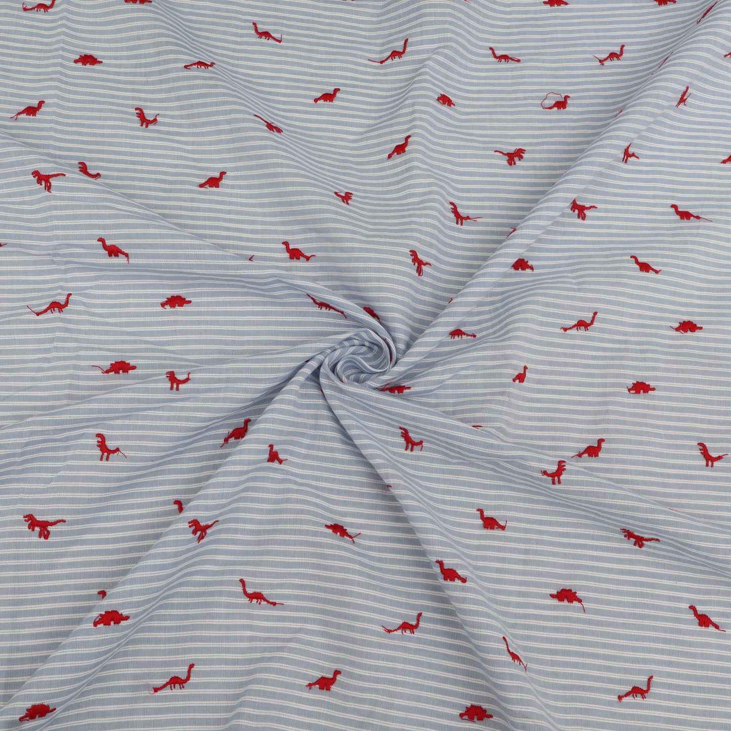 Fabric with red dinosaur pattern on blue and white striped background