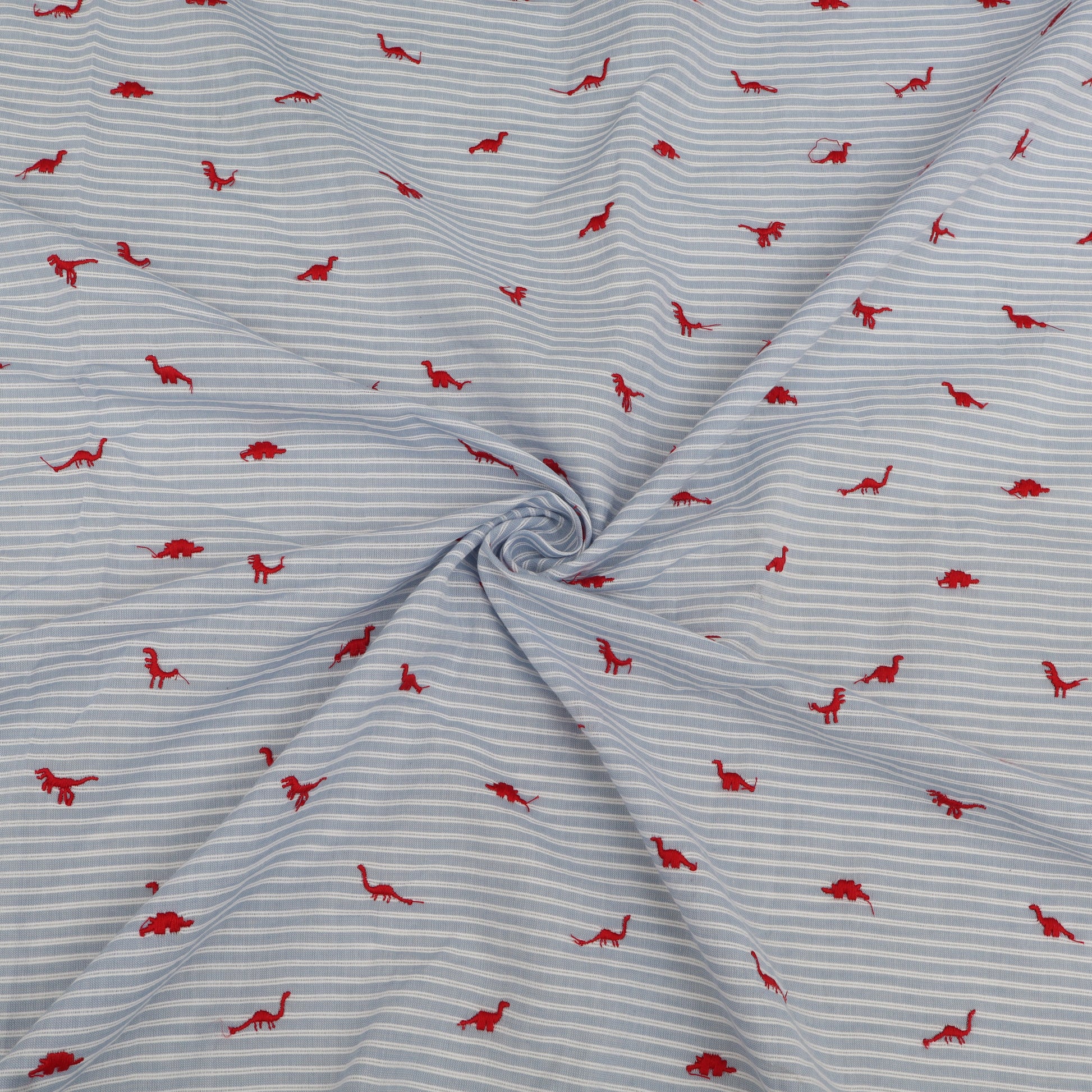 Fabric with red dinosaur pattern on blue and white striped background