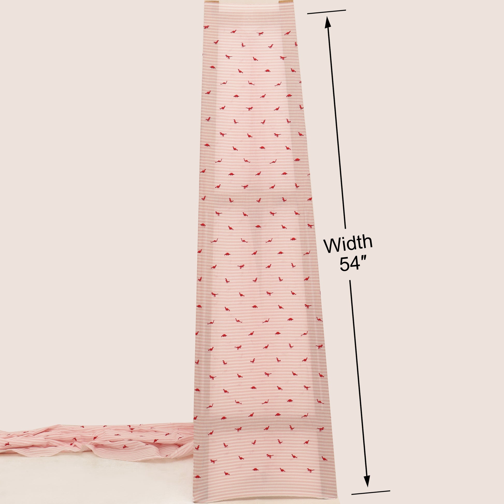 Pink fabric with a subtle pattern and measurement label on a beige background
