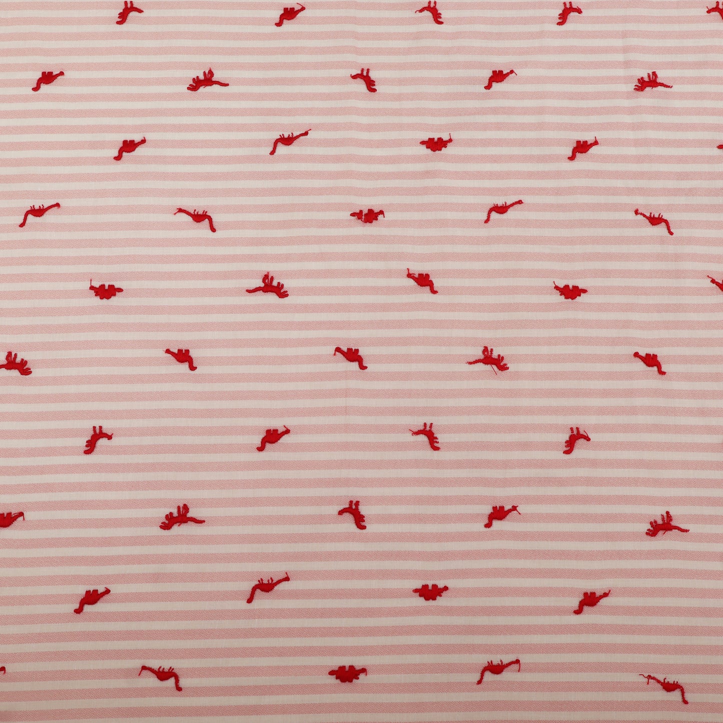 Red pattern on a pink striped background