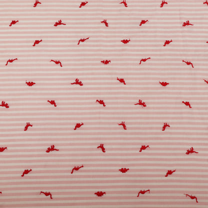 Red pattern on a pink striped background
