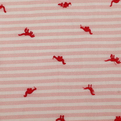 Red embroidered shapes on a pink and white striped fabric