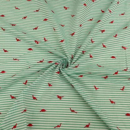 Green and white striped fabric with red dinosaur patterns