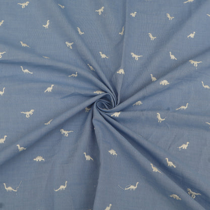 Blue fabric with white dinosaur patterns