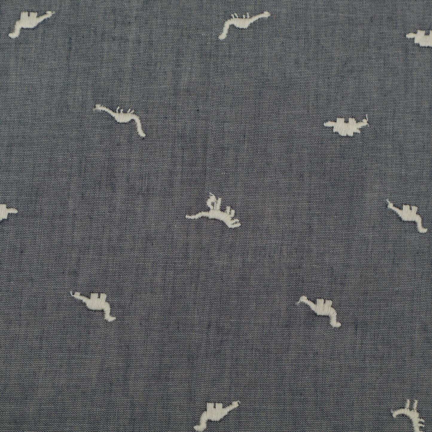 Textured blue fabric with small white animal prints