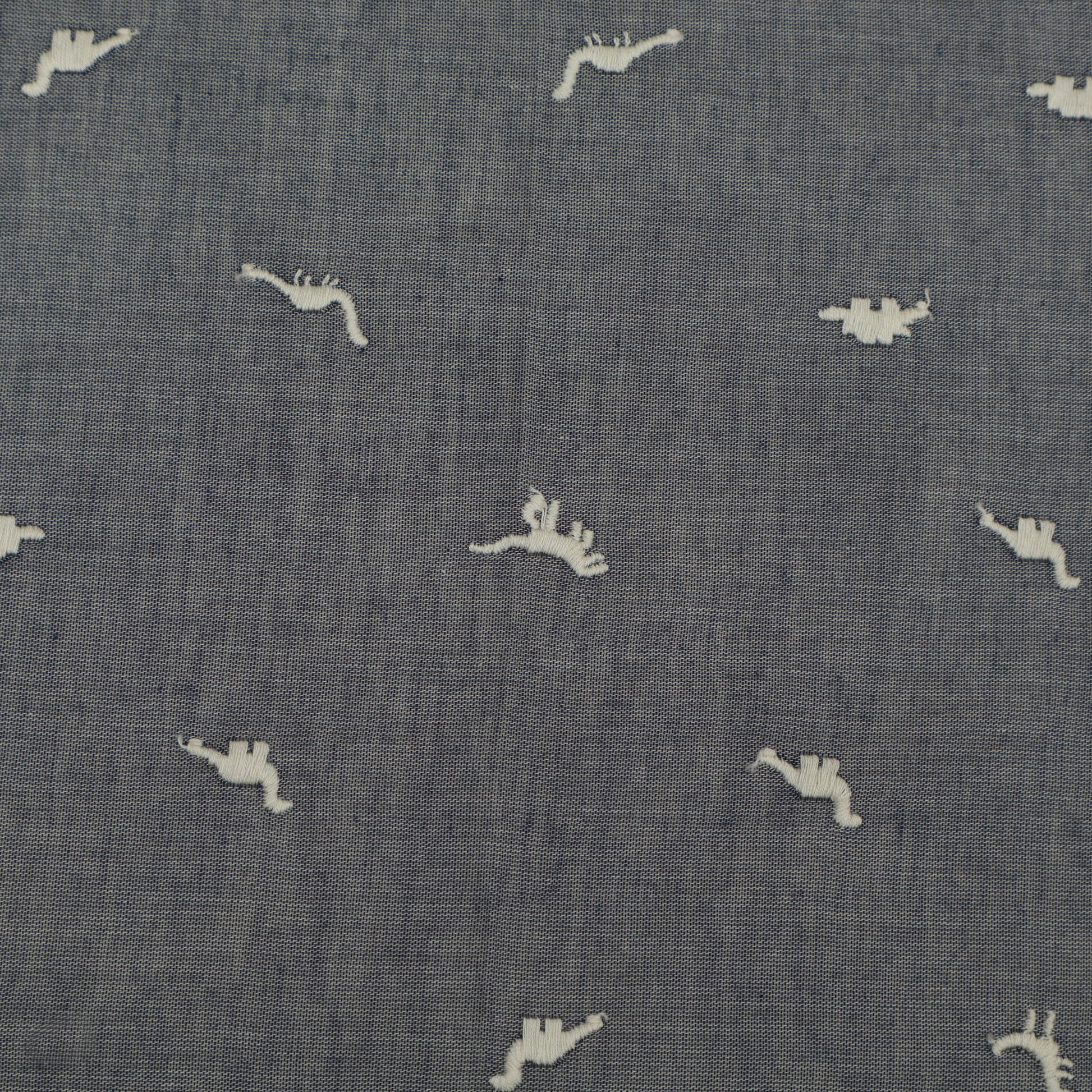 Textured blue fabric with small white animal prints