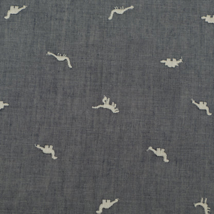 Textured blue fabric with small white animal prints