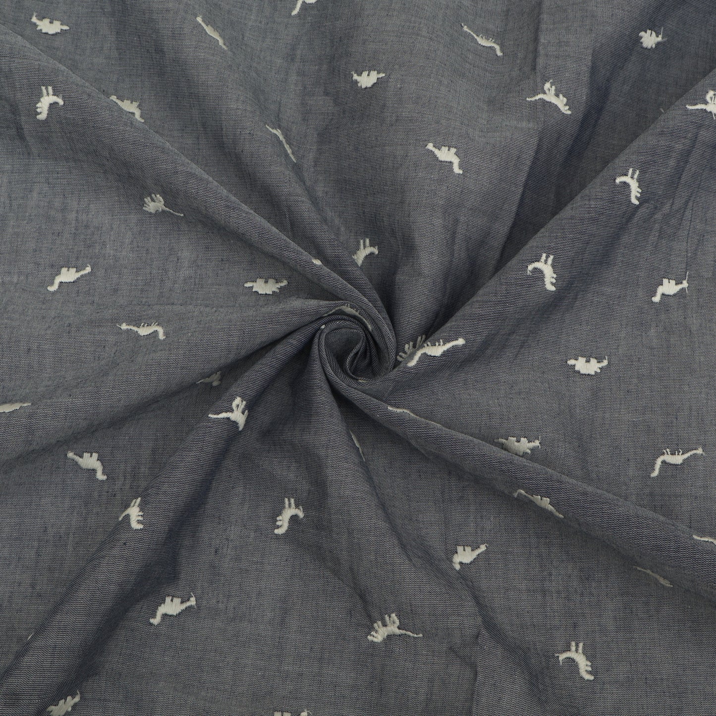 Dark gray fabric with small white patterns, rolled up