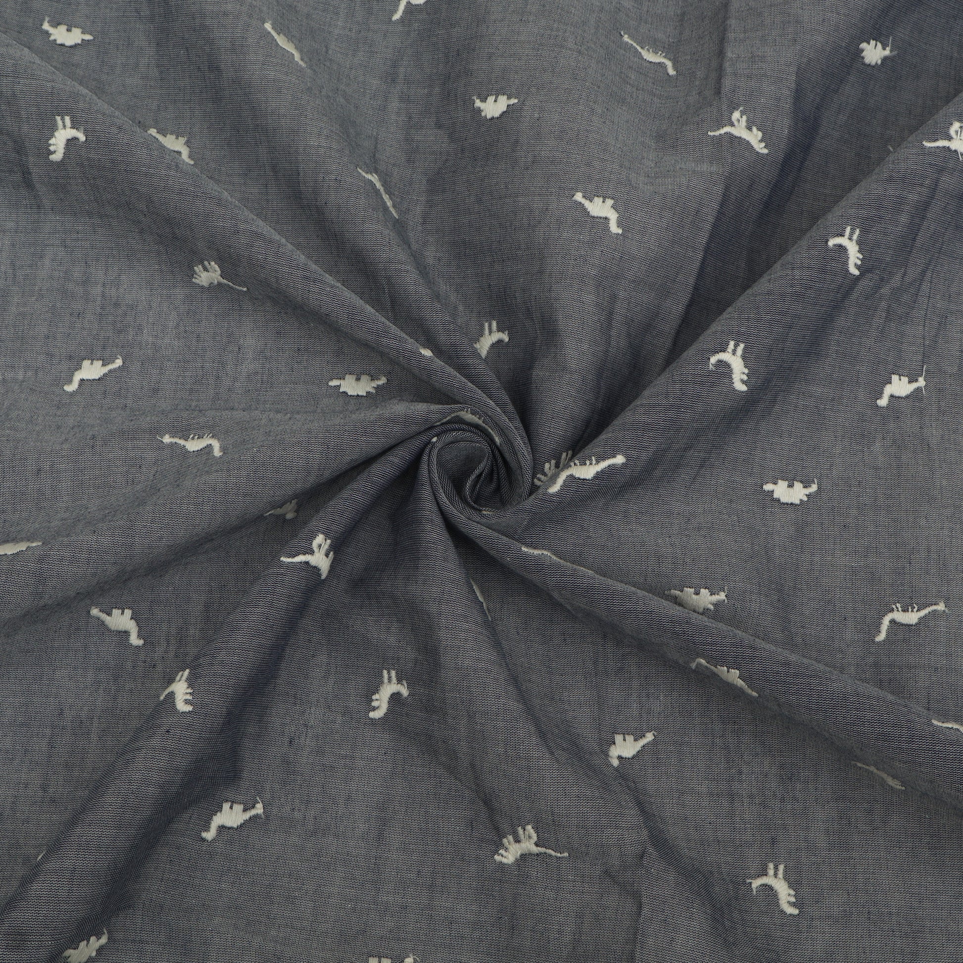 Dark gray fabric with small white patterns, rolled up