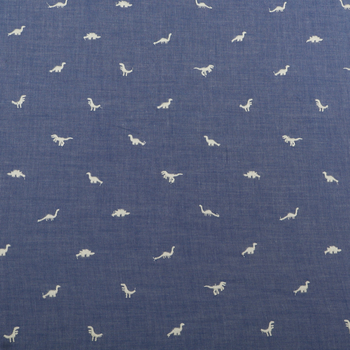 Blue fabric with white dinosaur pattern