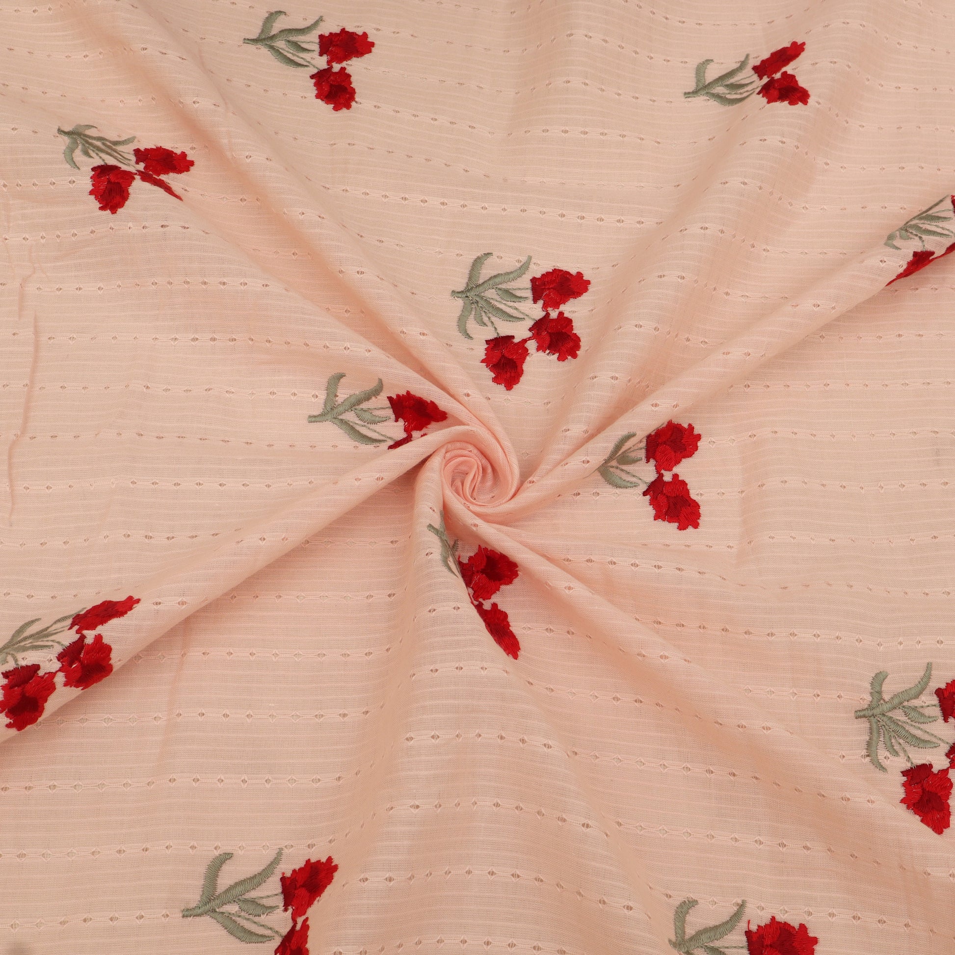Pink fabric with red floral embroidery