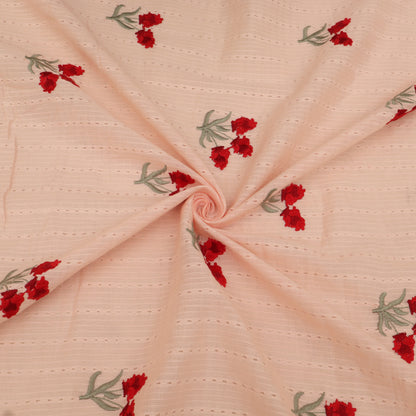 Pink fabric with red floral embroidery
