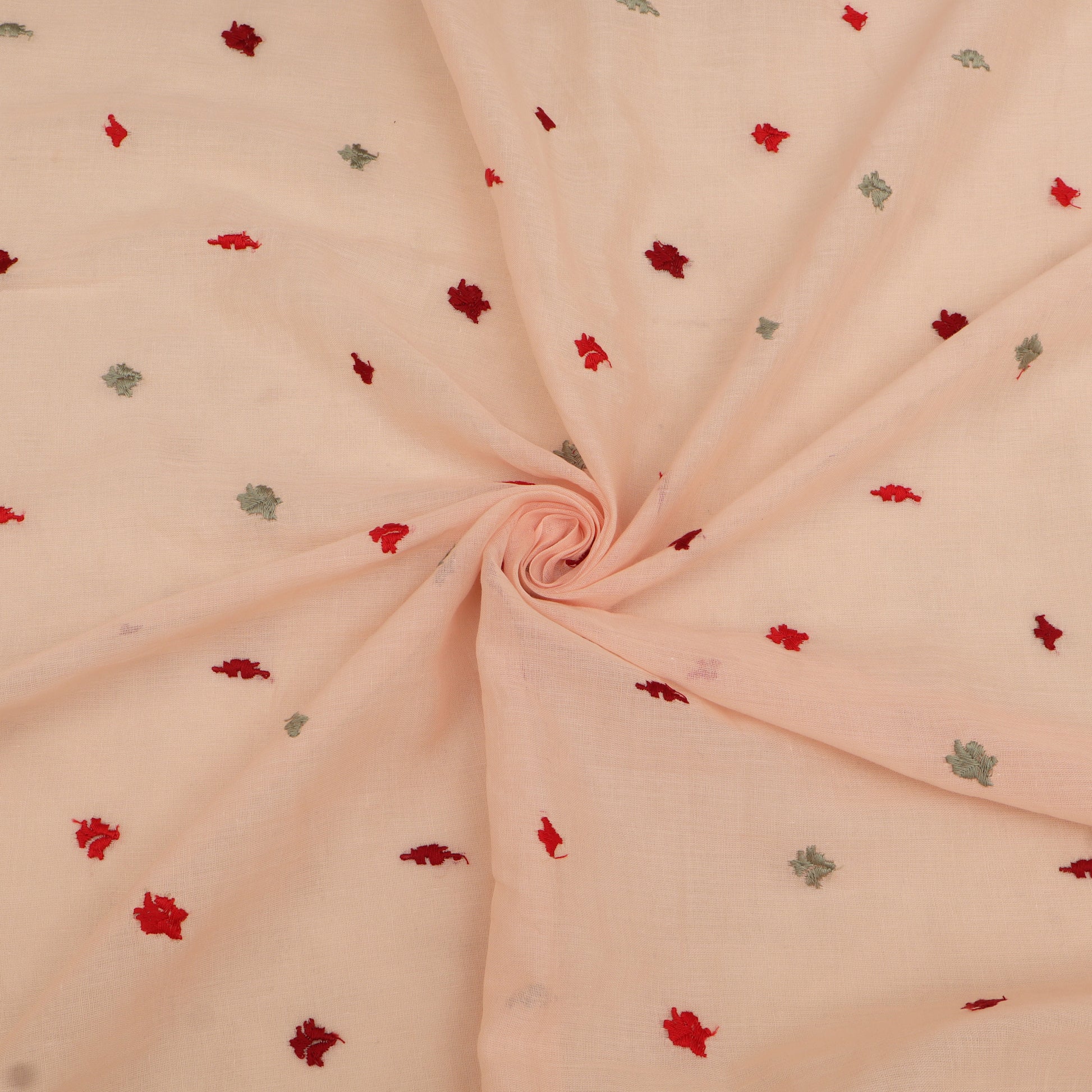Pink fabric with small red and green floral patterns