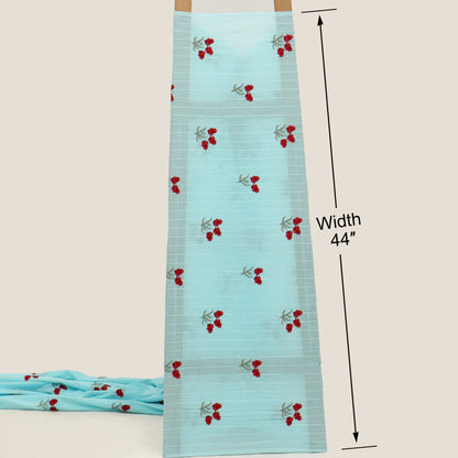Light blue fabric with red floral patterns on a beige background, showing width measurement.