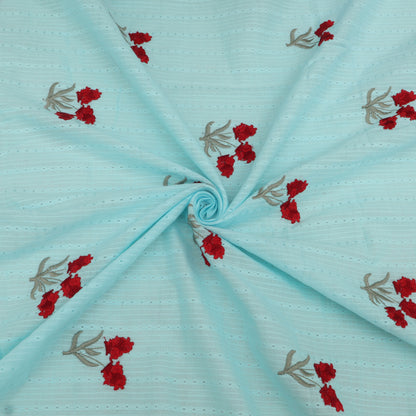 Light blue fabric with red floral embroidery