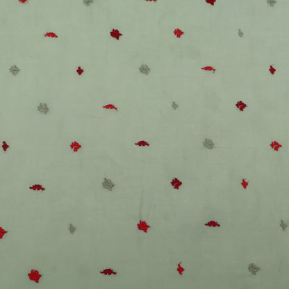 Pattern of red and gray shapes on a light green background
