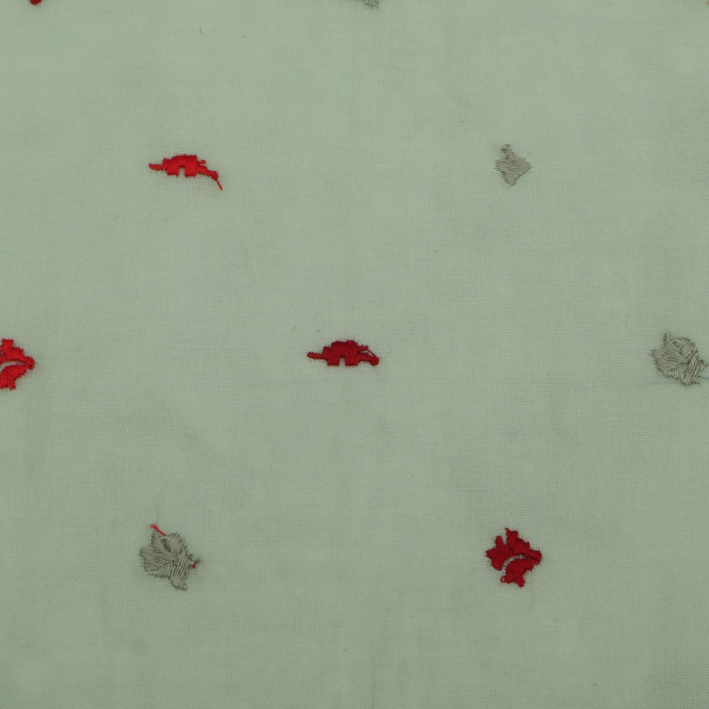 Pattern of red and gray shapes on a light green background
