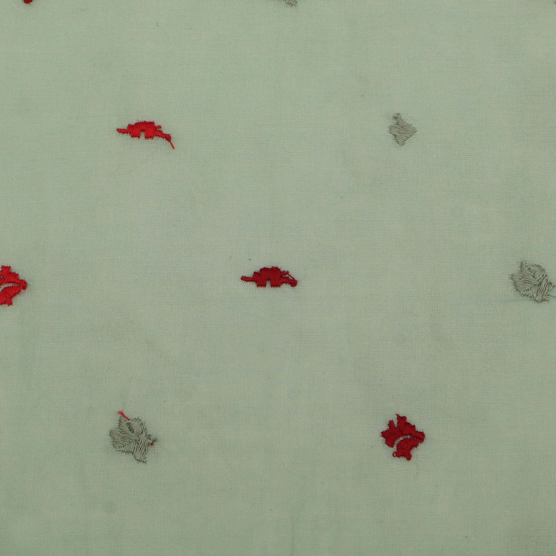 Pattern of red and gray shapes on a light green background