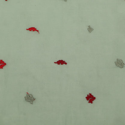 Pattern of red and gray shapes on a light green background