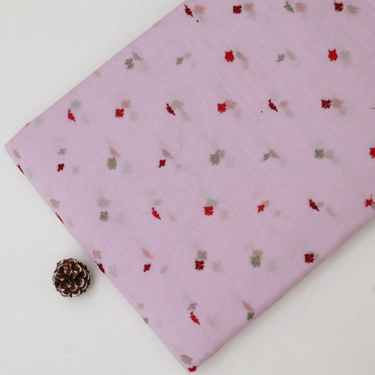 Pink fabric with small floral pattern on a white surface