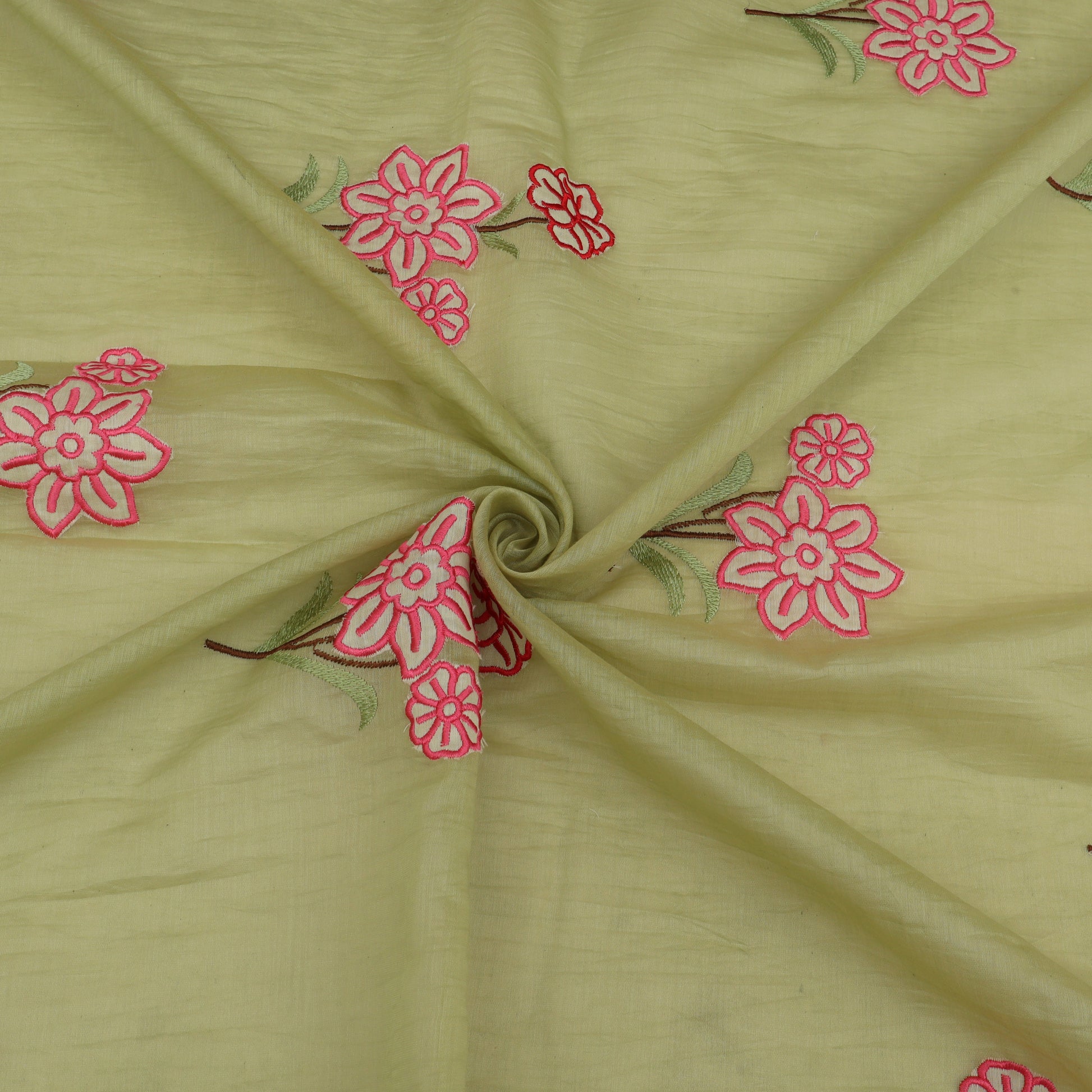 Green fabric with pink floral embroidery