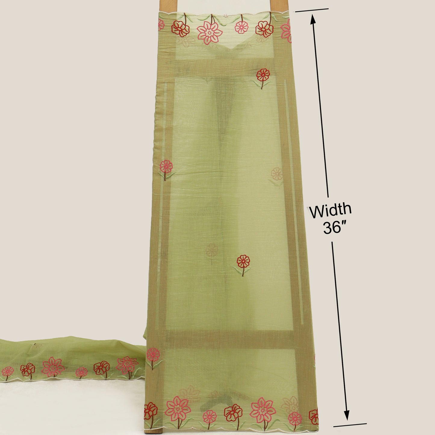 Pattern of floral designs with red centers on a dark green background