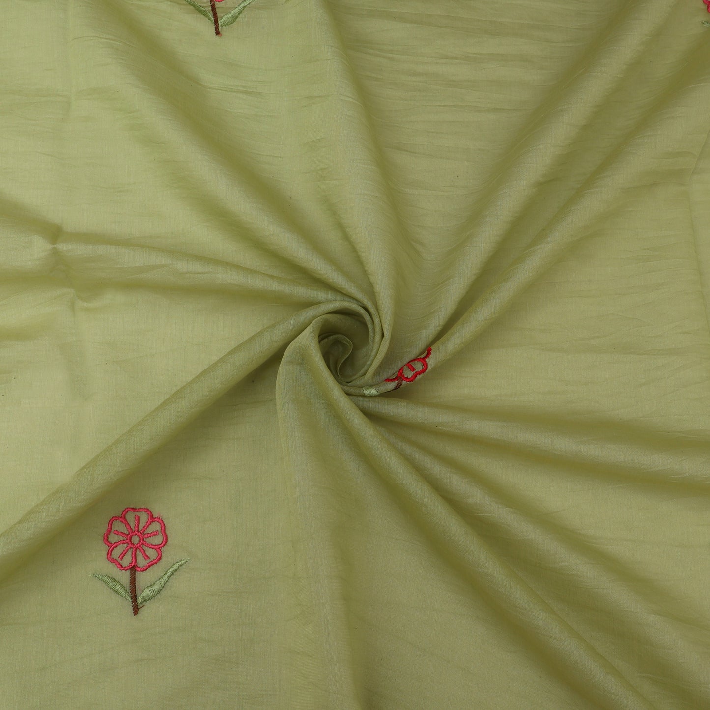 Green fabric with red floral embroidery