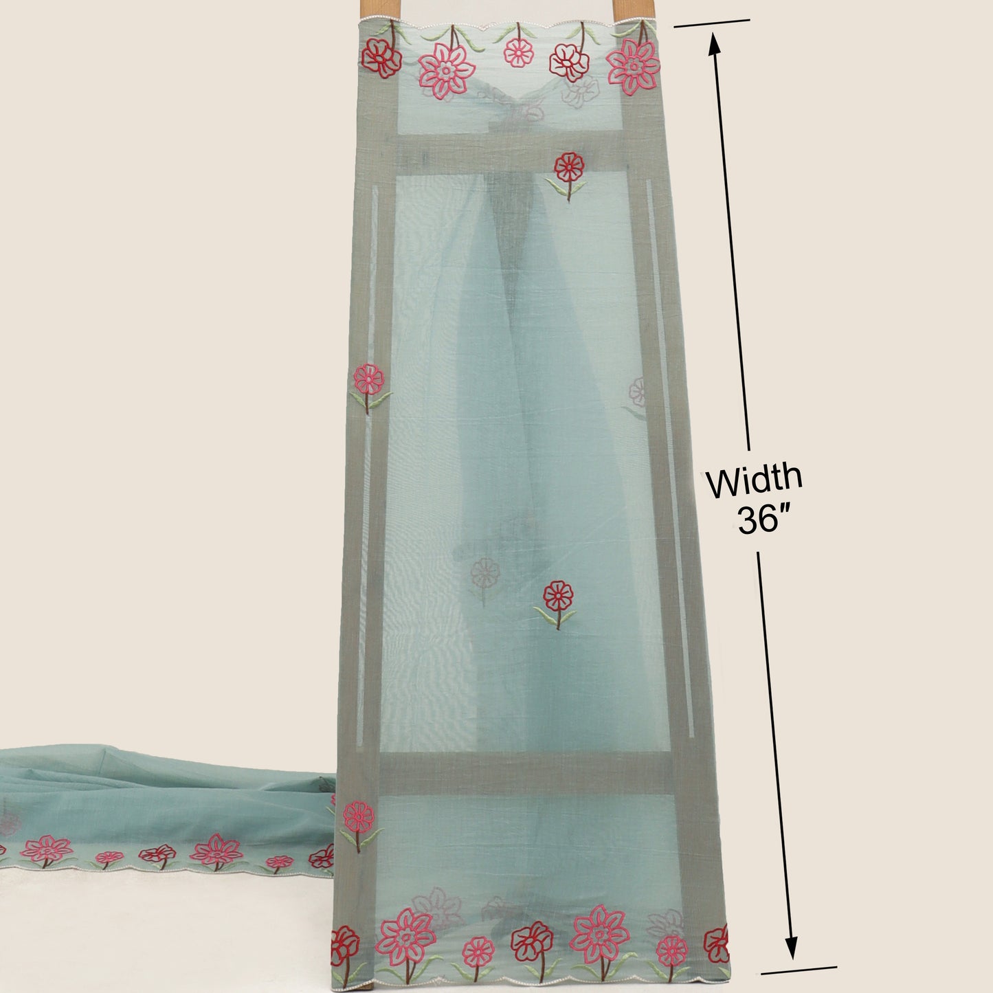 Sheer curtain with floral embroidery on a beige background