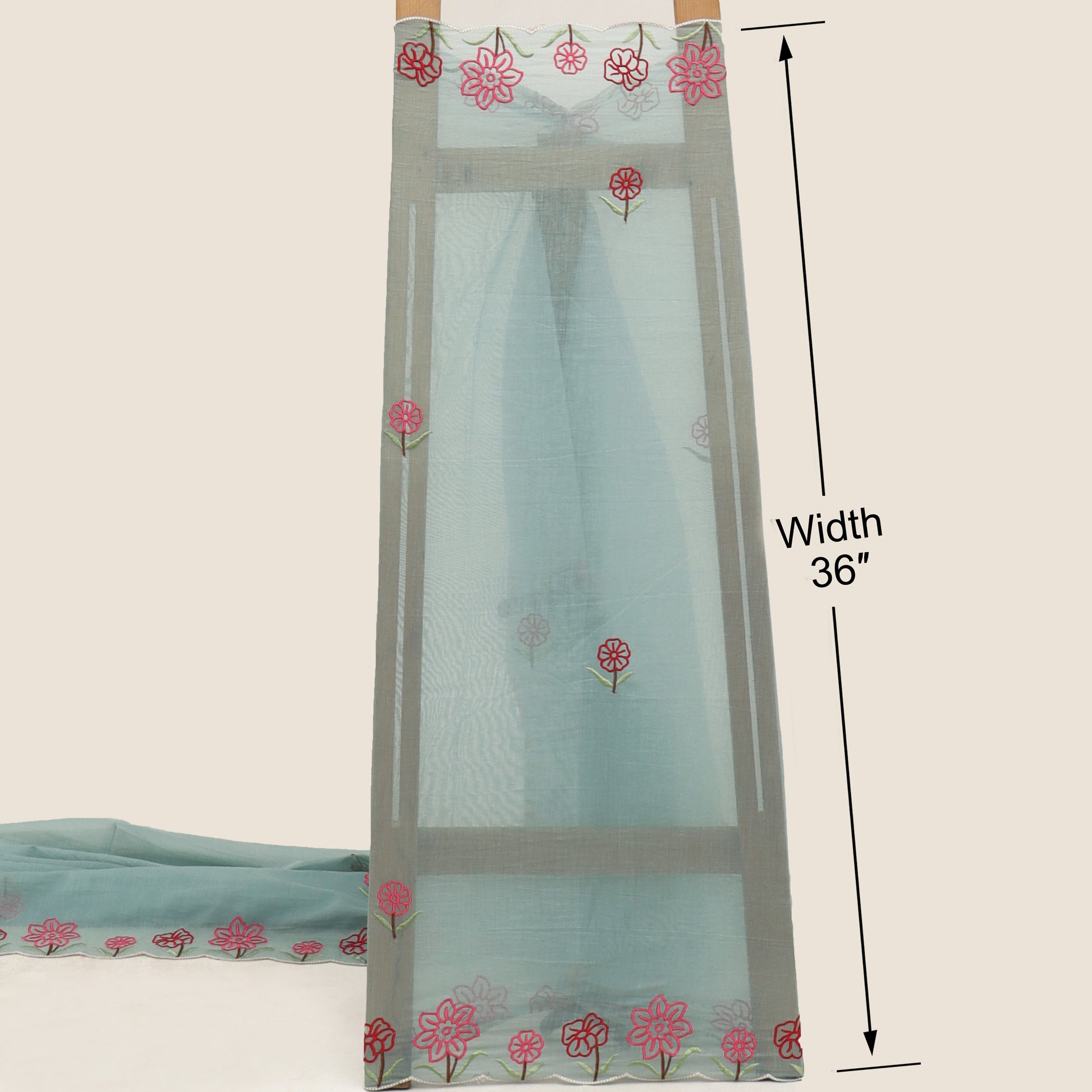 Sheer curtain with floral embroidery on a beige background