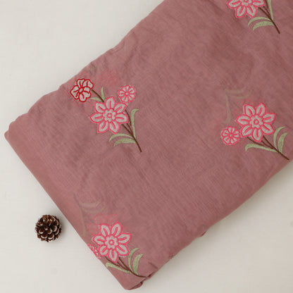 Pink fabric with floral patterns on a white background