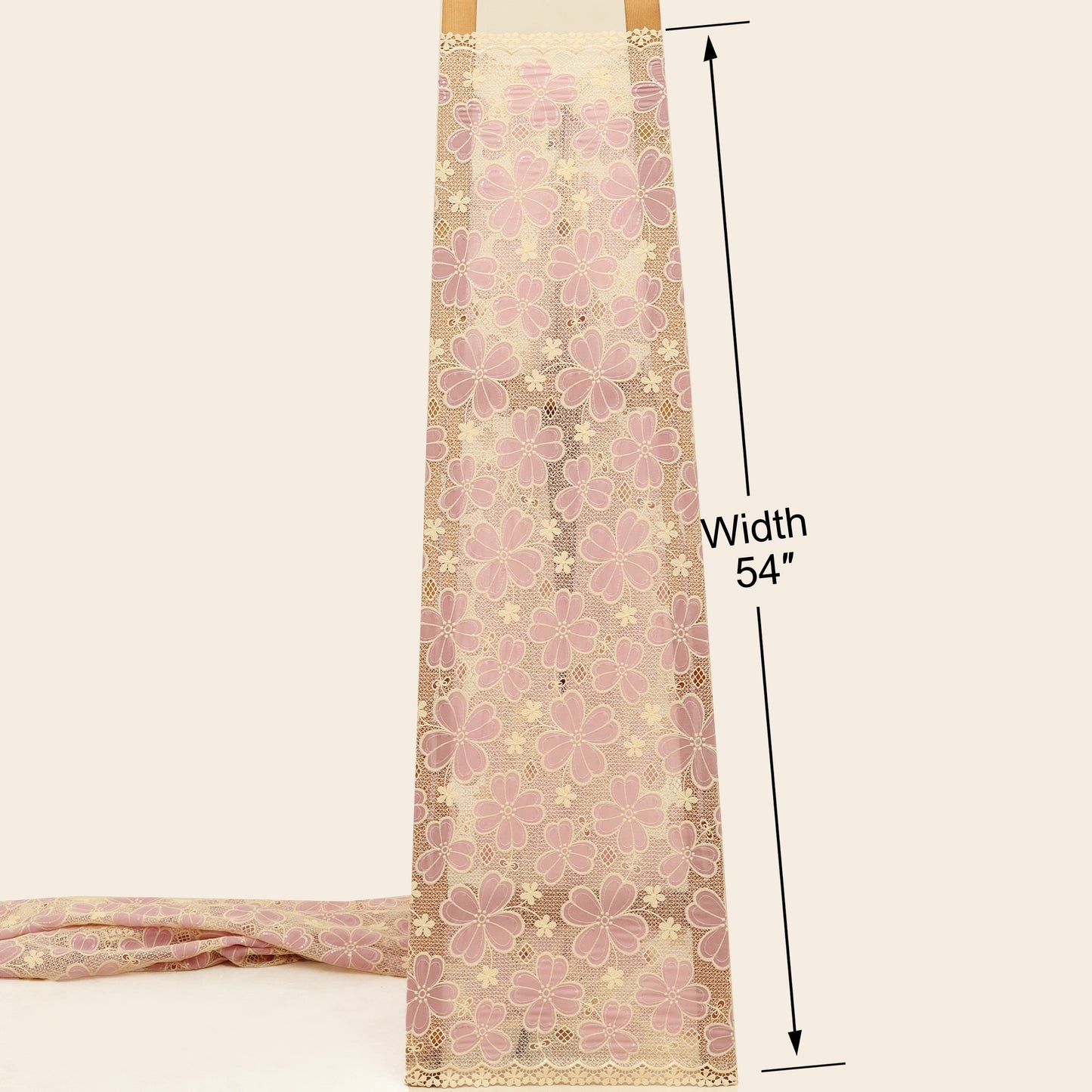 Floral lace fabric with a width measurement of 54 inches on a beige background