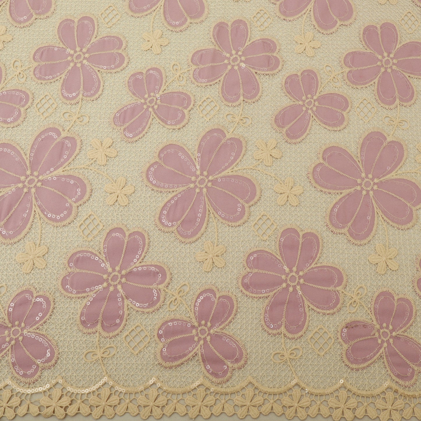 Patterned fabric with pink flowers and beige background