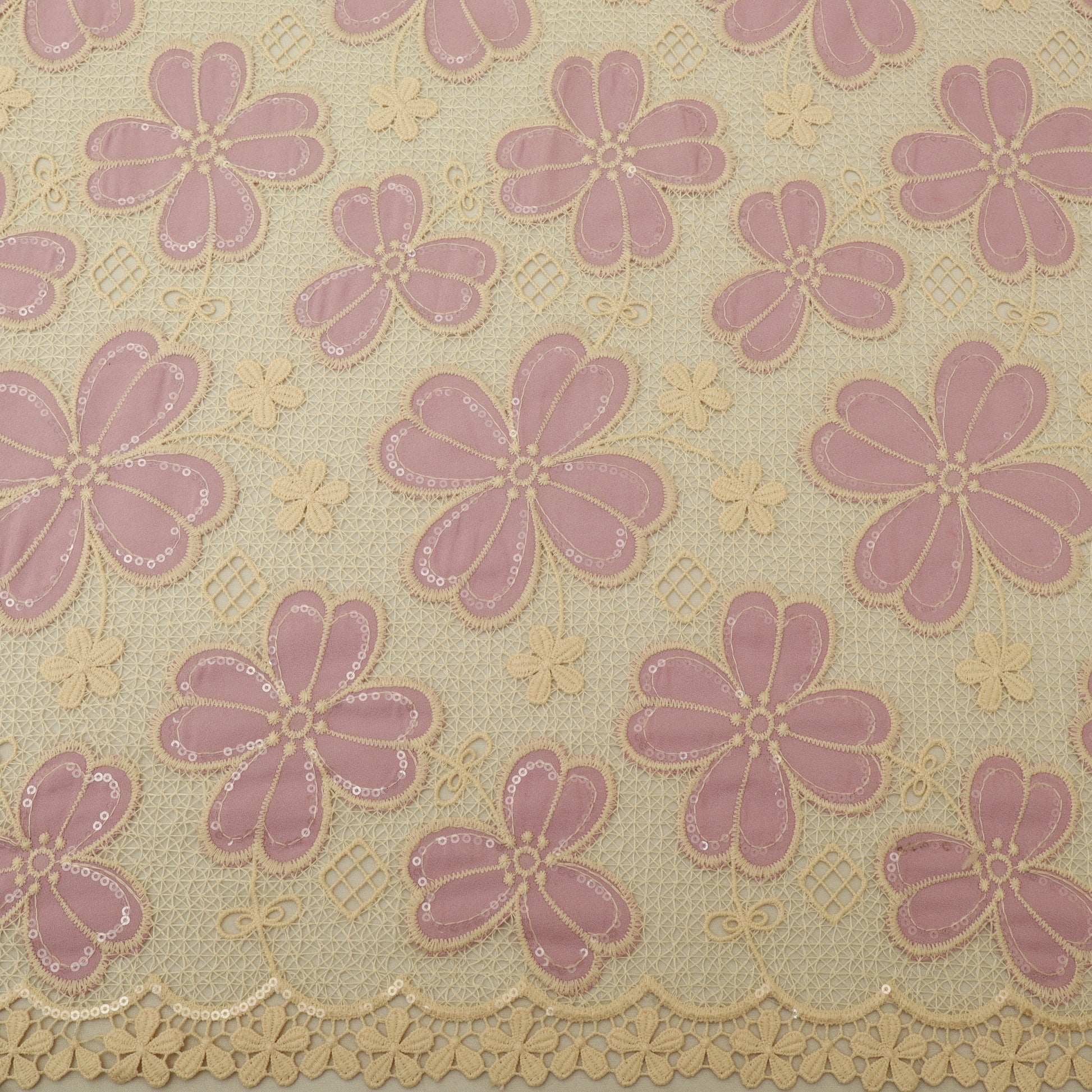 Patterned fabric with pink flowers and beige background
