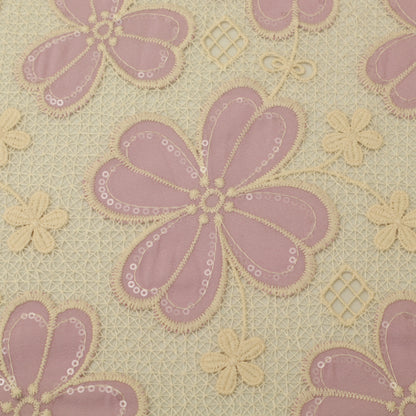 Patterned fabric with pink and beige flowers on a beige background