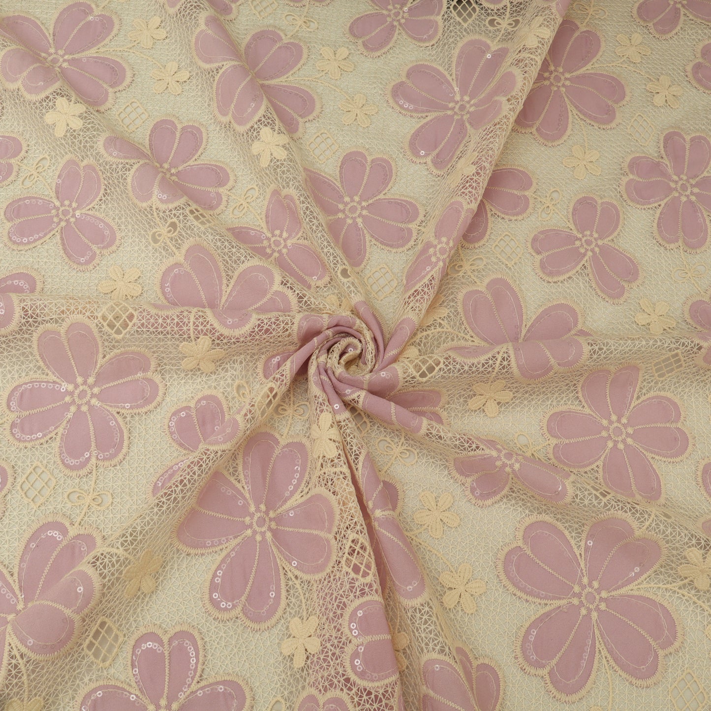 Lace fabric with pink floral pattern on beige background