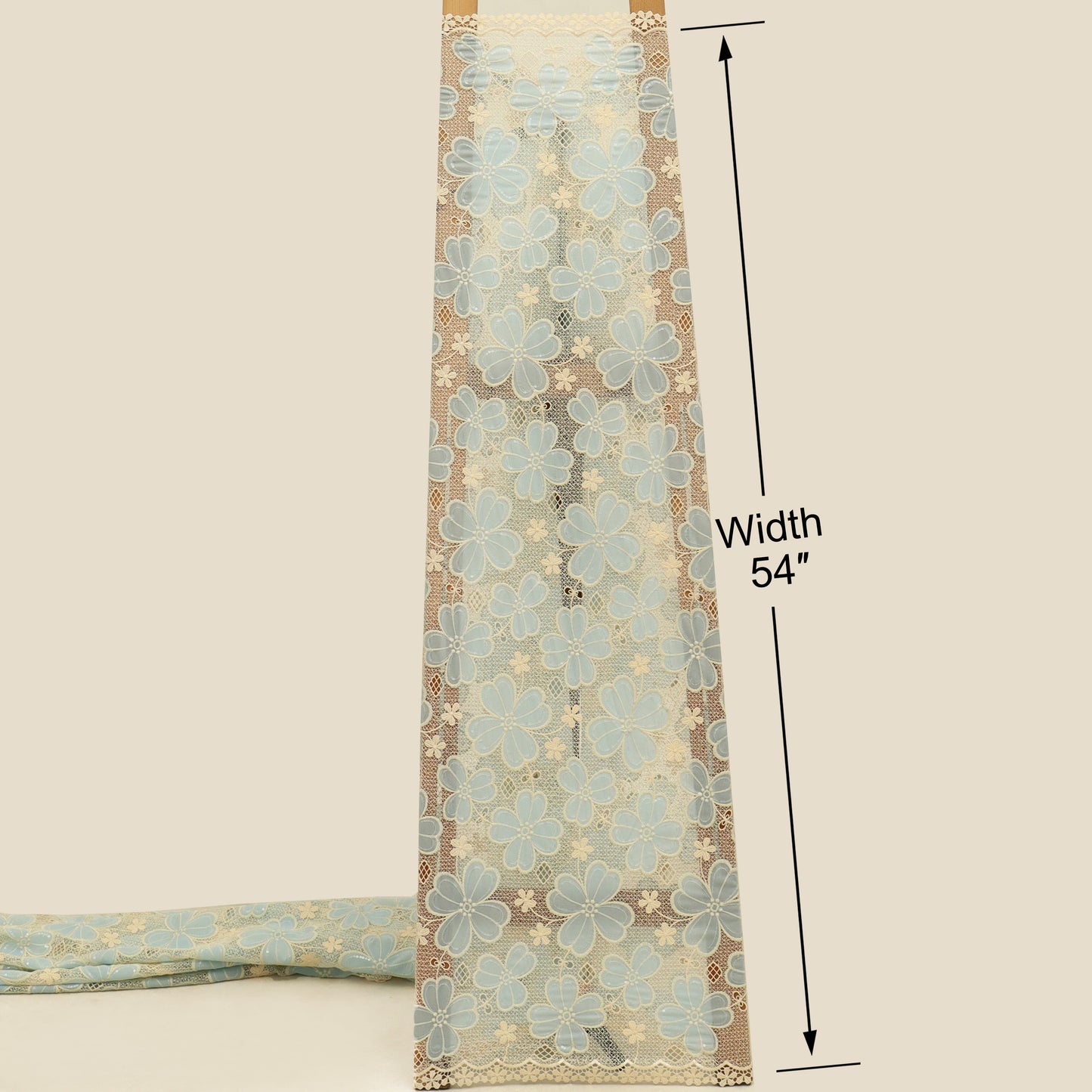 Floral patterned fabric with a width measurement of 54 inches on a beige background