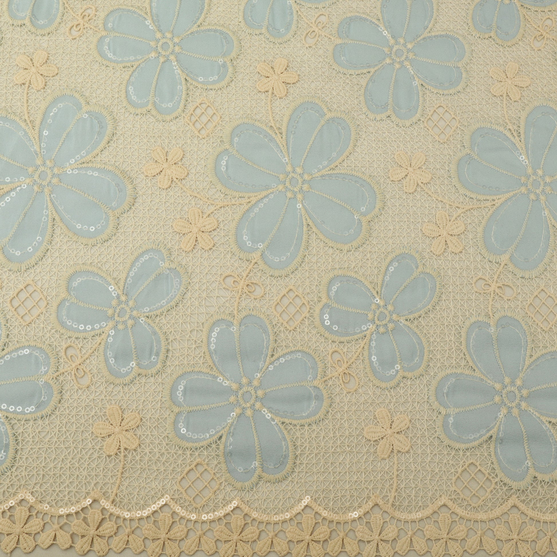 Patterned fabric with blue flowers on a beige background