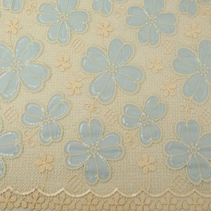 Patterned fabric with blue flowers on a beige background