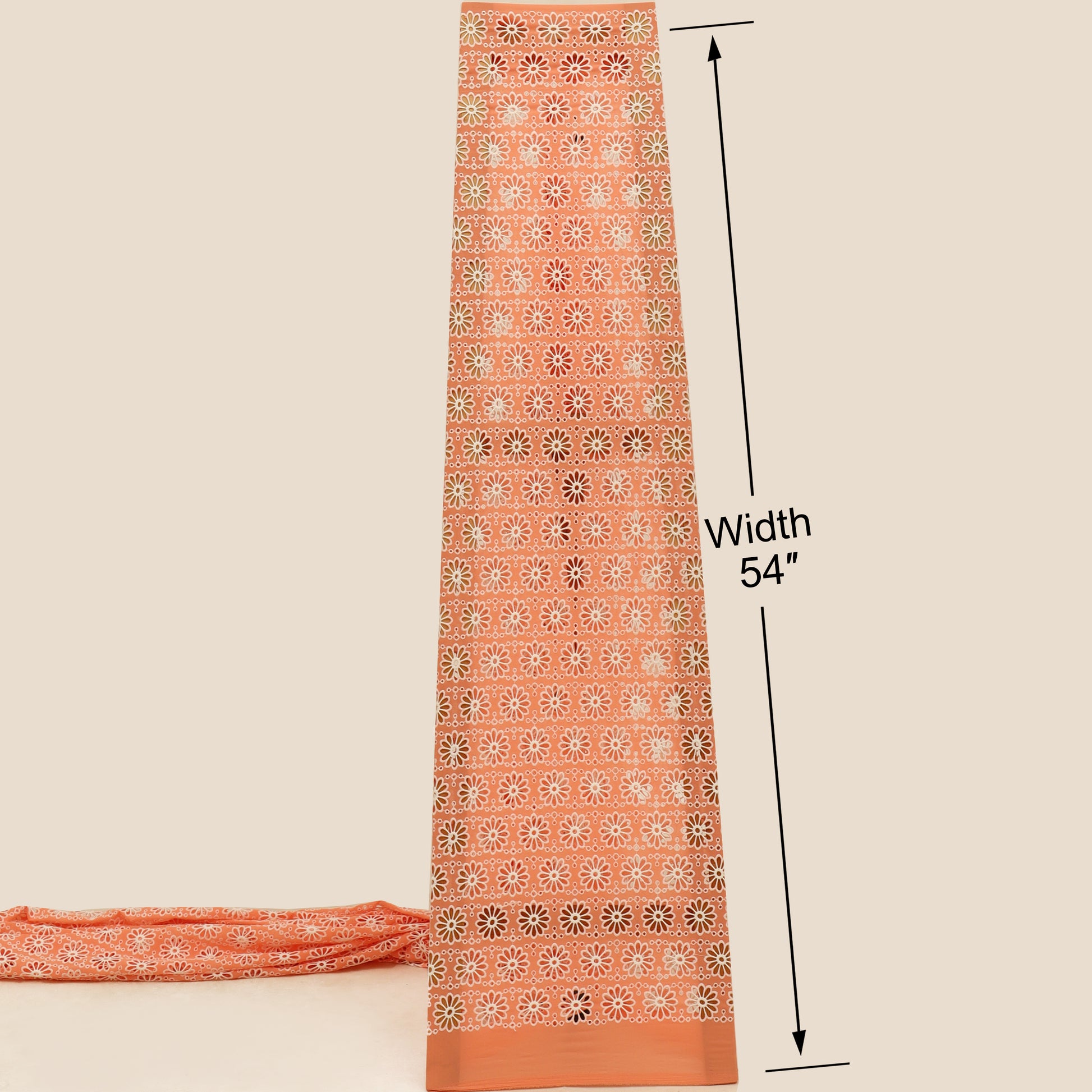 Orange fabric with a pattern and measurement label on a beige background
