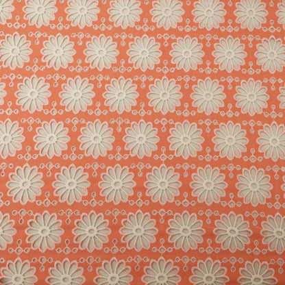 Pattern of white flowers on a coral background