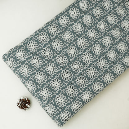 Fabric with white floral pattern on a gray background